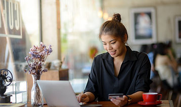 A woman make payment online using credit card