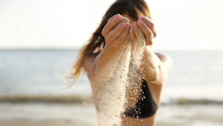 Hands Pouring Sand