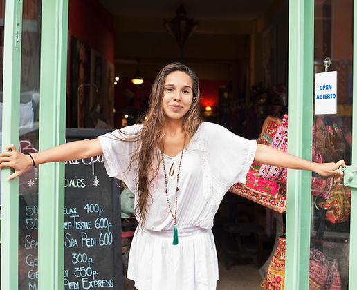 Smiling professional woman in front of childcare agency – representing trusted nanny services in DC, Maryland, and Virginia