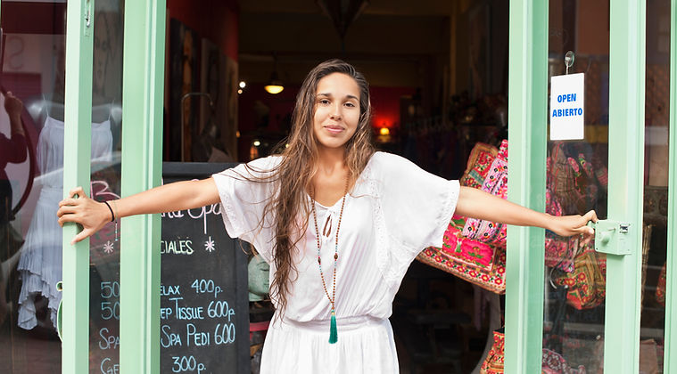 Smiling professional woman in front of childcare agency – representing trusted nanny services in DC, Maryland, and Virginia