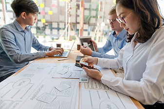 Digital marketing experts planning paid media strategies for client success