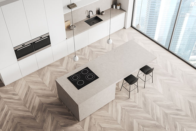 Kitchen Interior with white units and breakfast bar with hob