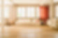 Bright, cosy living room with white sofas and a wooden floor