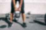 woman lifting a kettlebell