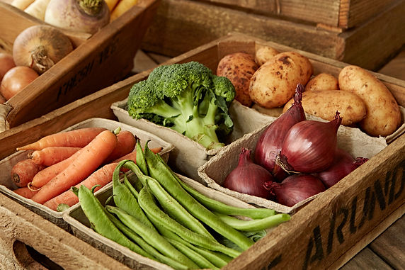 Still life fresh, organic, healthy vegetable harvest variety in wood crate