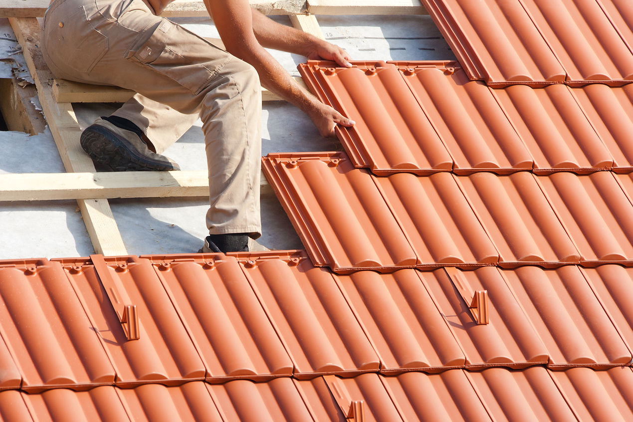 Roofer repairing a roof
