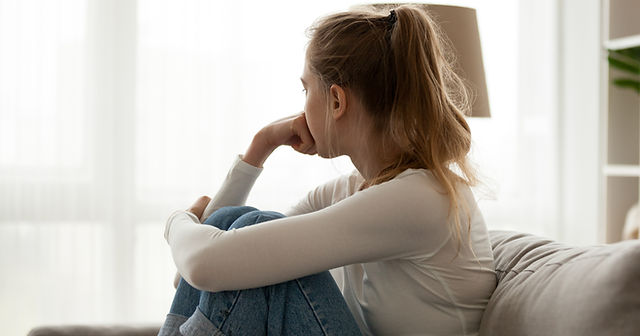 Woman on couch looking away