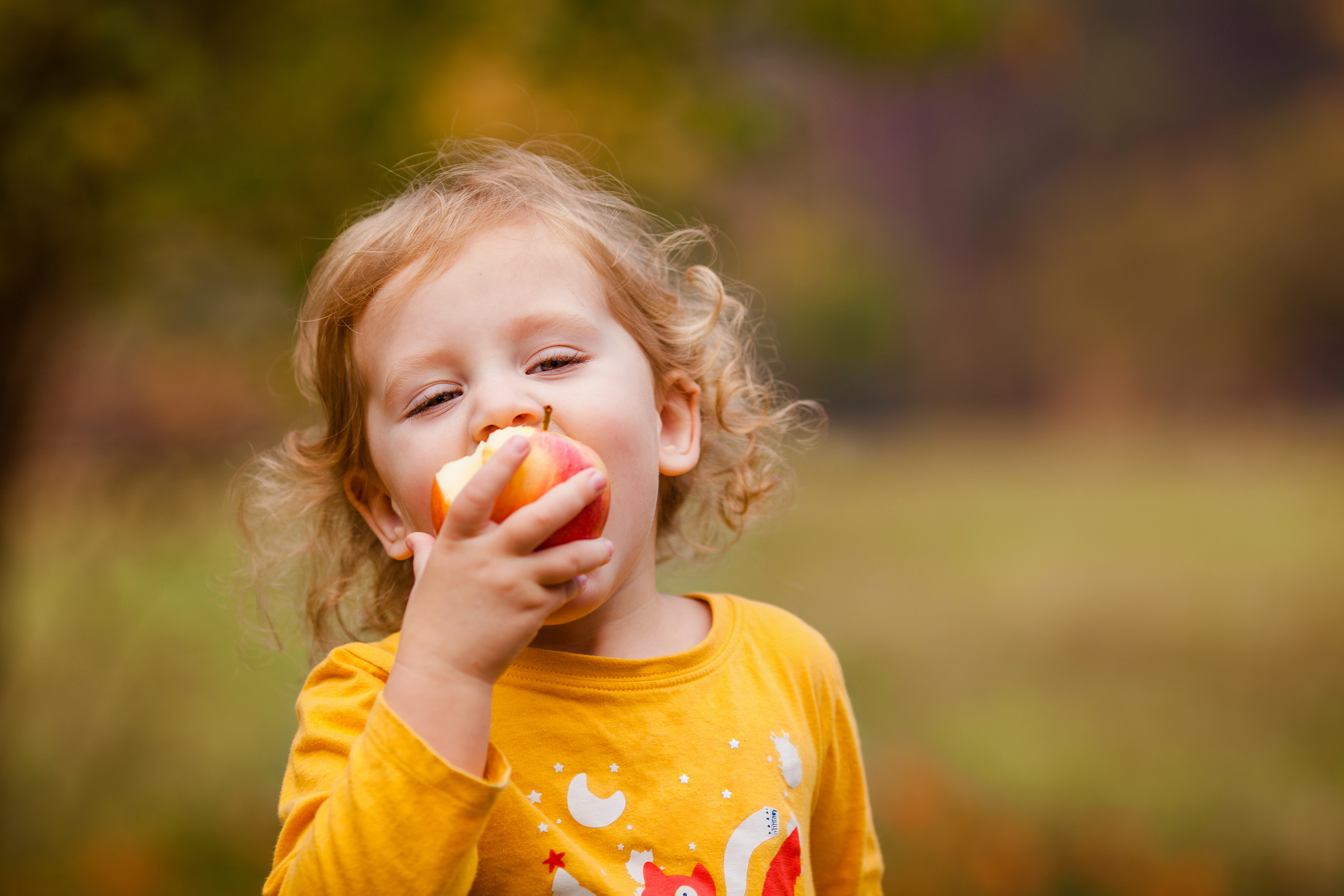 Cute Girl Eating Apple