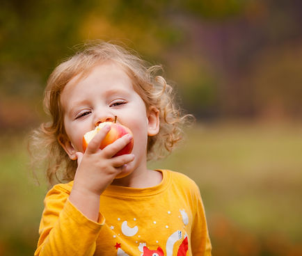 Child Eating Apple