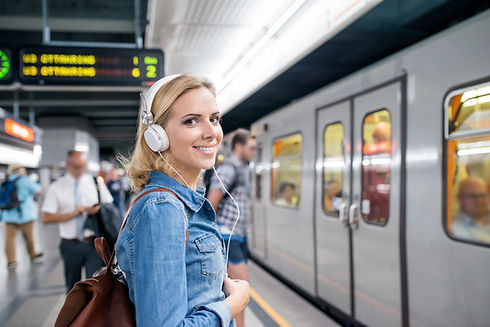 Woman with headphones in metro