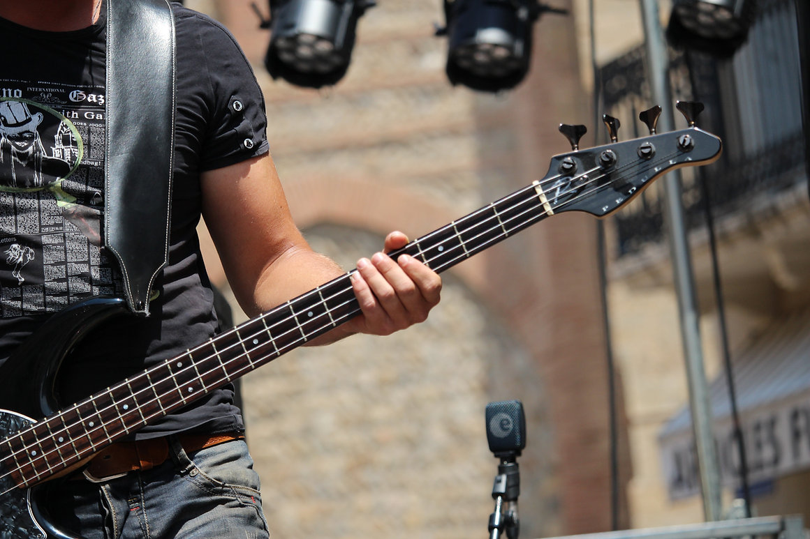 A Musician Playing Bass Guitar