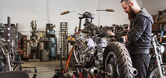 Man Fixing Motorcycle
