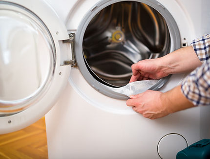 View of a person cleaning the washing machine