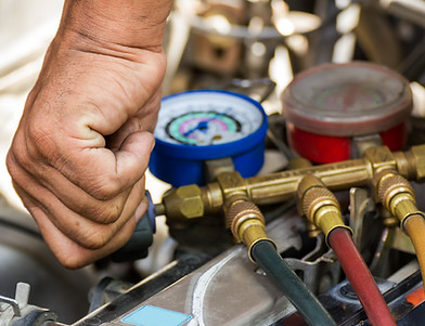 technician with gauges