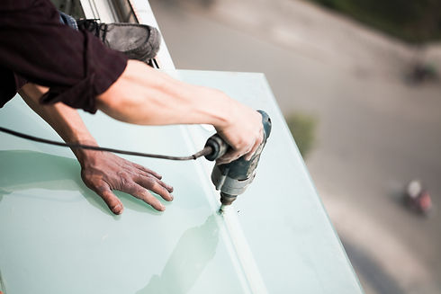 Roofer installing a glass roof