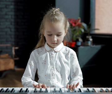 Girl in Piano Class