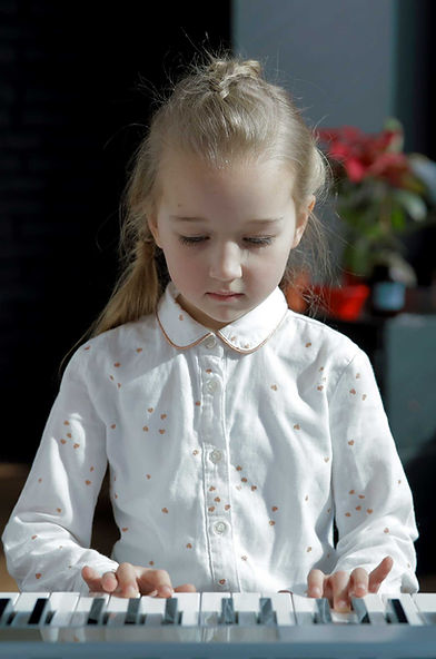 Girl in Piano Class