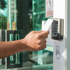 Picture of person using a door keypad