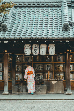 Woman in kimono at traditional Japanese store