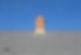 Gray tile roof and chimney on house with blue sky background