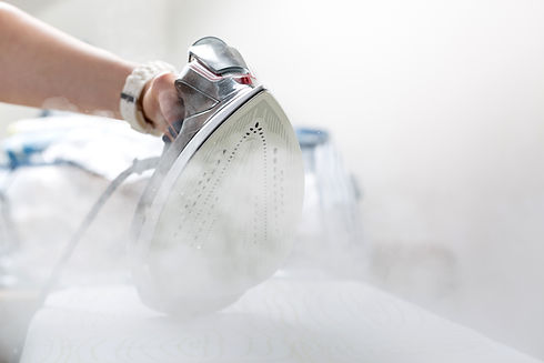 Steam iron in use