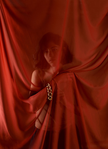 Behind Red Curtains