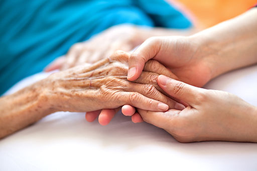 Gently holding hands representing supportive dementia care services