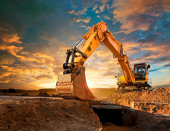 A yellow excavator at a construction site