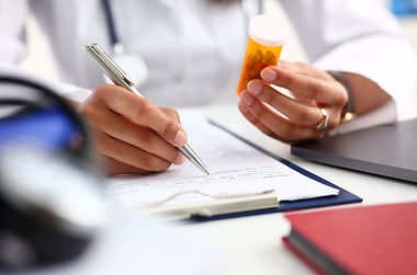 Doctor Holding Prescription