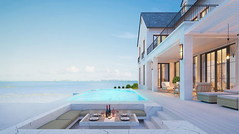 A dinner table on the balcony by the sea