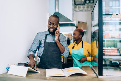 two people working in a cafe