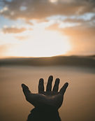 Hand Reaching Sunset