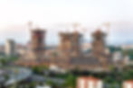 image of a bustling construction site with heavy machinery, symbolizing the ongoing development activities for HSE Realty