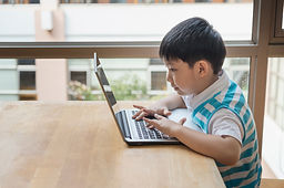 Decorative Image: Kid in a computer