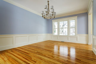Newly painted room with a chandelier