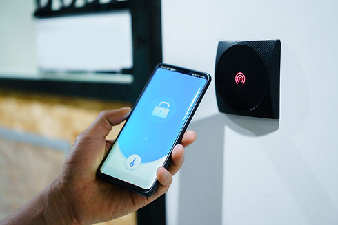 A hand holds a smartphone with a digital lock symbol on its screen
