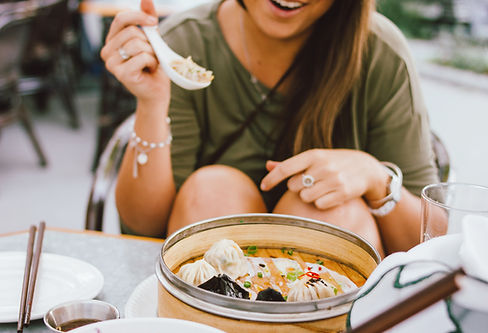 Woman Eating Dumplings