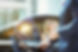 Chauffeur opening car door for businesswoman