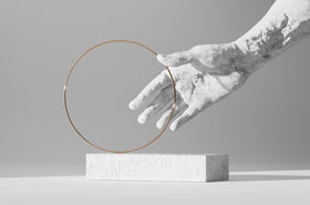 Holding a Gold Hoop