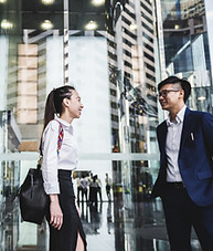 Asian colleagues having a chat after work