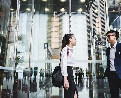 Asian colleagues having a chat after work