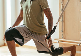 A person performing simple balance and strengthening exercises under the guidance of a physiotherapist, demonstrating the foundations of safe, confident movement.