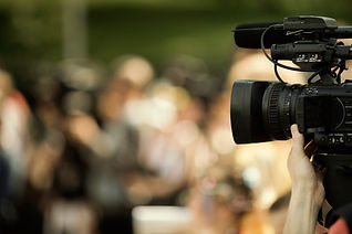 a person's hand and a camera