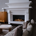 Fireplace in a living room with sofa