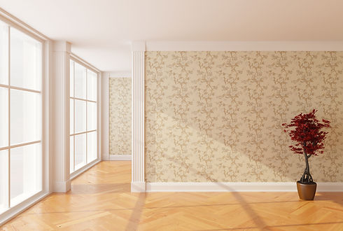 A wall with a floral design wallpaper