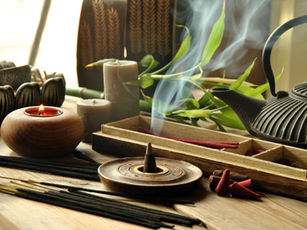 Sandalwood stick and cone incense on a wooden table