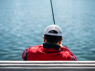 man in red jacket fishing