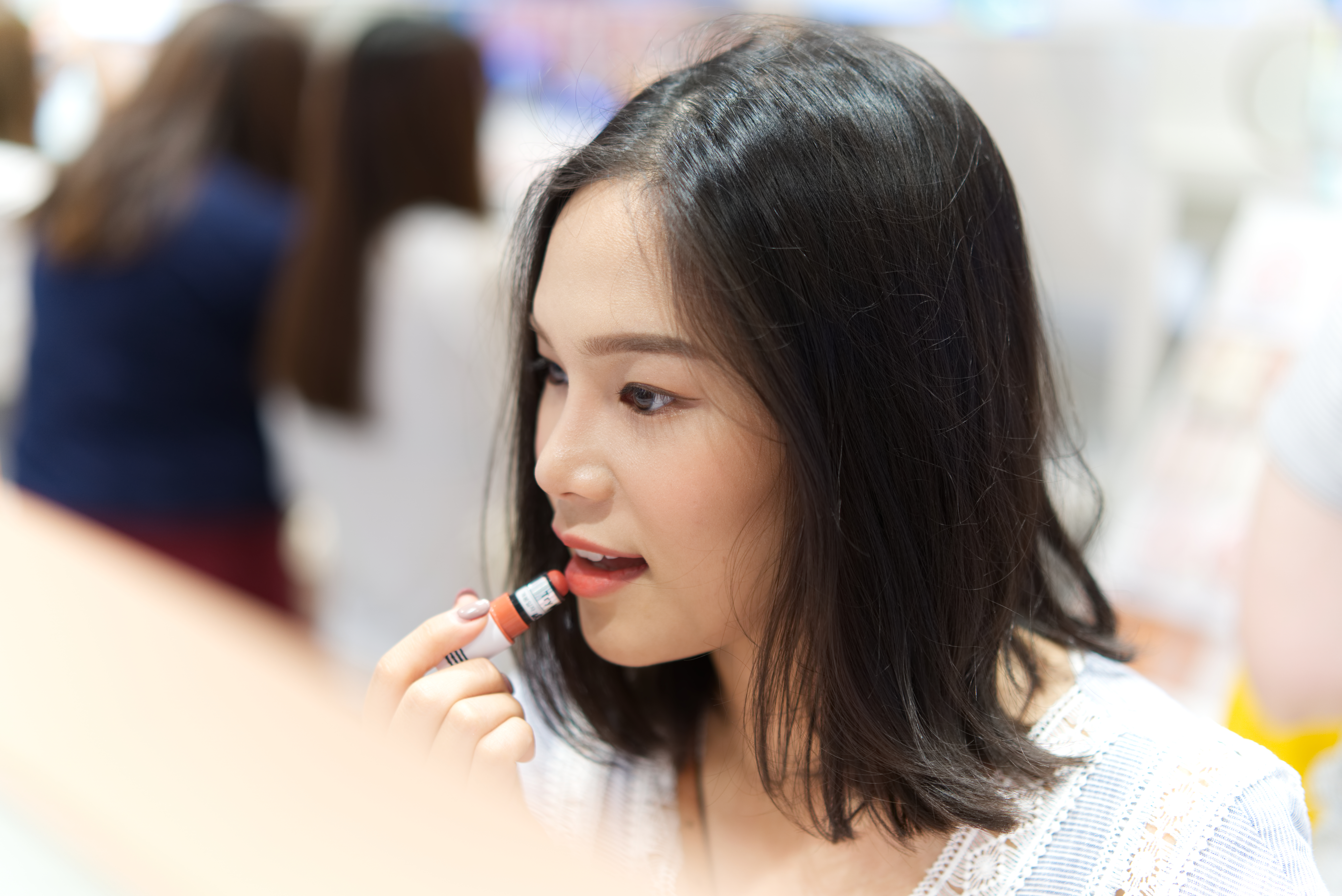 Person Applying Lipstick