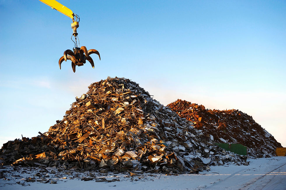 Pile of scrap metal with crane