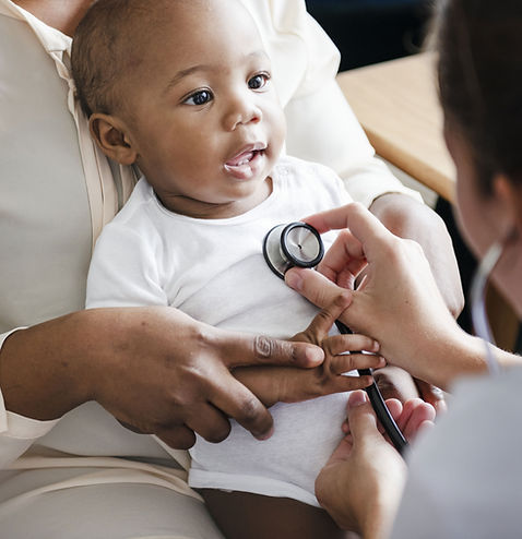 Doctor examining baby